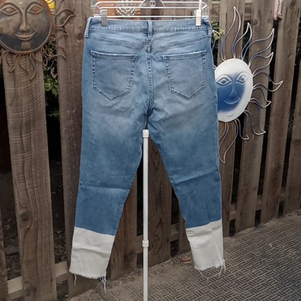 Woman's blue, very stretching material distressed jeans. Size 8. Jogging?
